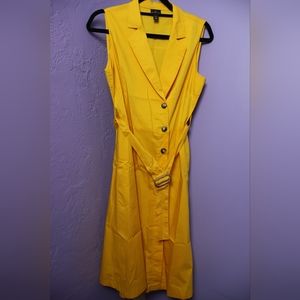 Yellow sleeveless dress.